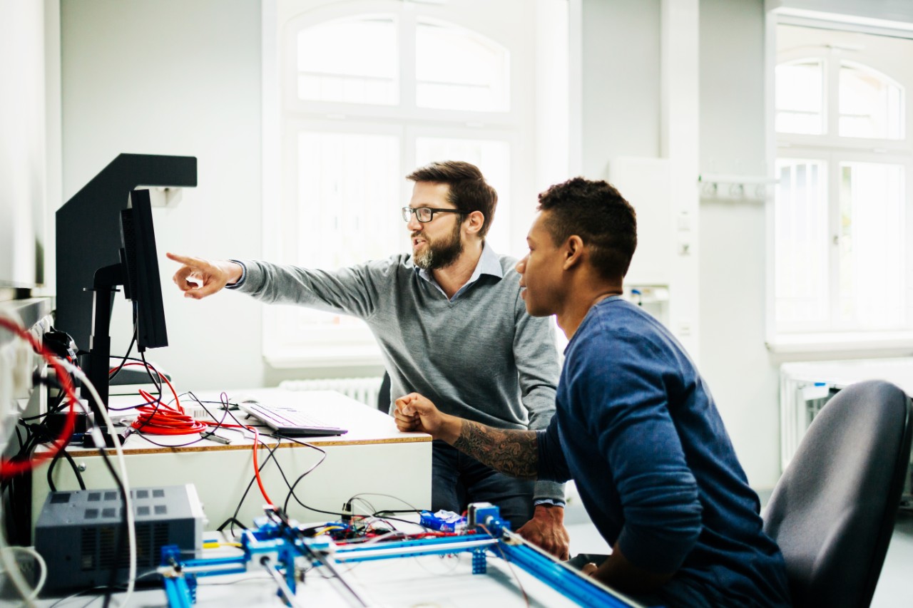 engineers-collaborating-at-computer-workstation.jpg