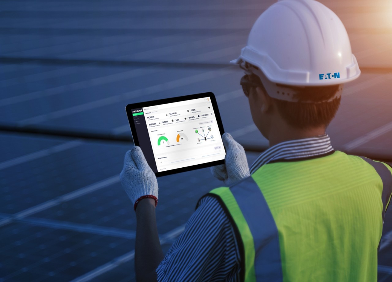 Engineer in solar farm tablet visualization