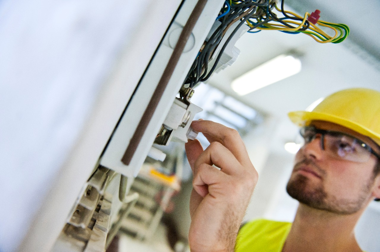electrician repairing circuit breakers getty 534053790