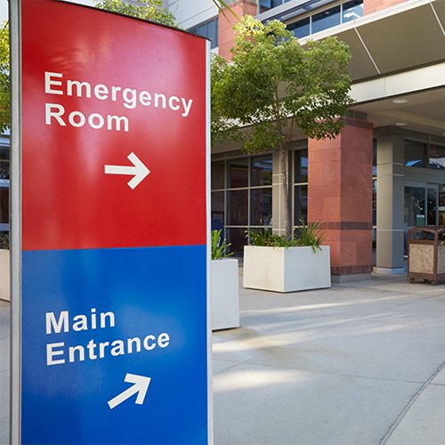 Main Entrance Of Modern Hospital Building With Signs