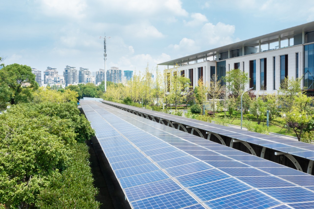 cityscape-solar-panel-building-greenery-getty-1339826957
