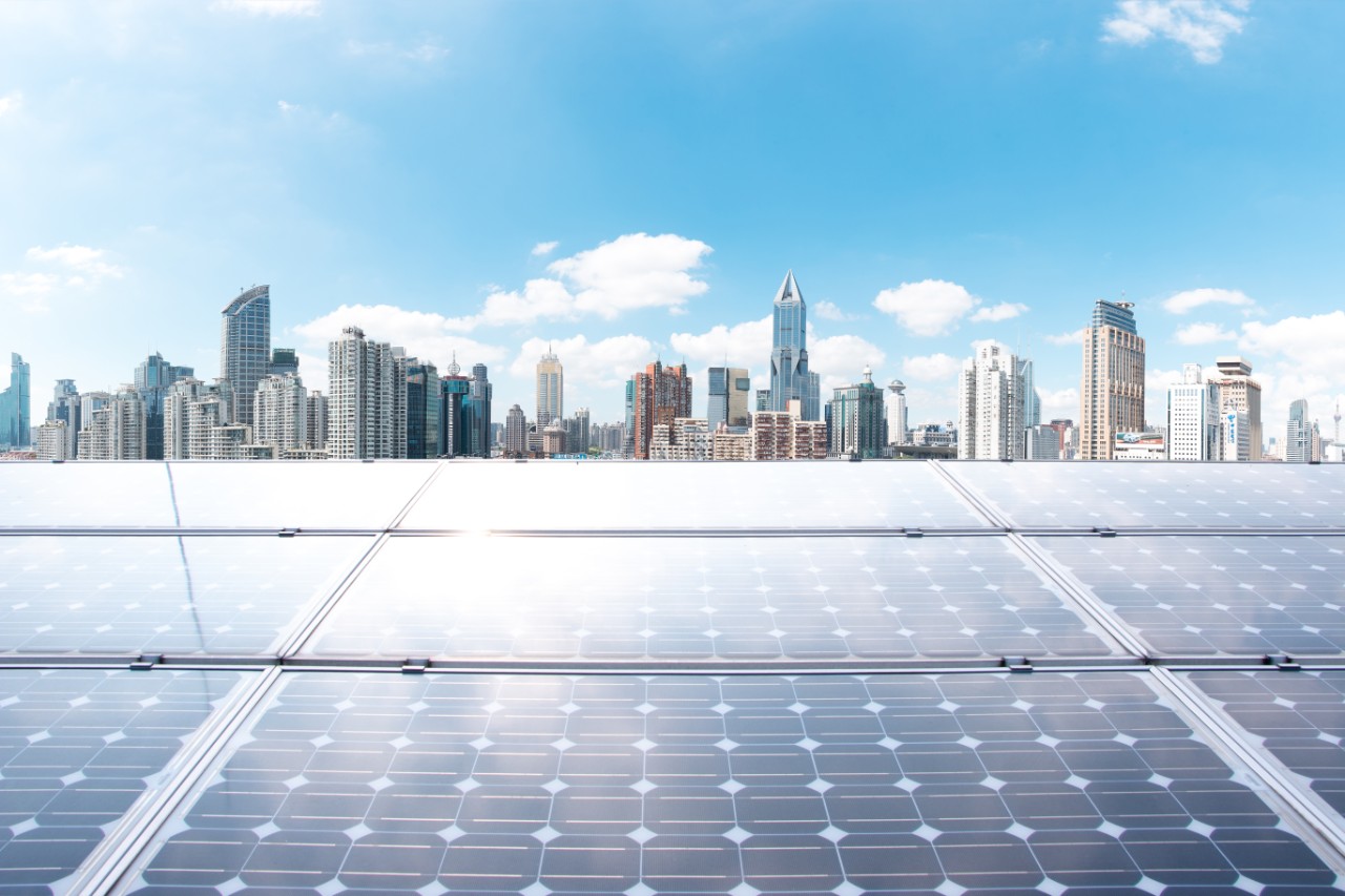 solar-panels-with-city-skyline-background-getty-1158448190